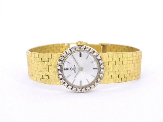 Omega - Montre mécanique en or 18 carats et diamants 58 Facettes 8034