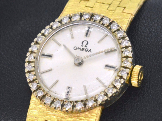Omega - Montre mécanique en or 18 carats et diamants 58 Facettes 8034