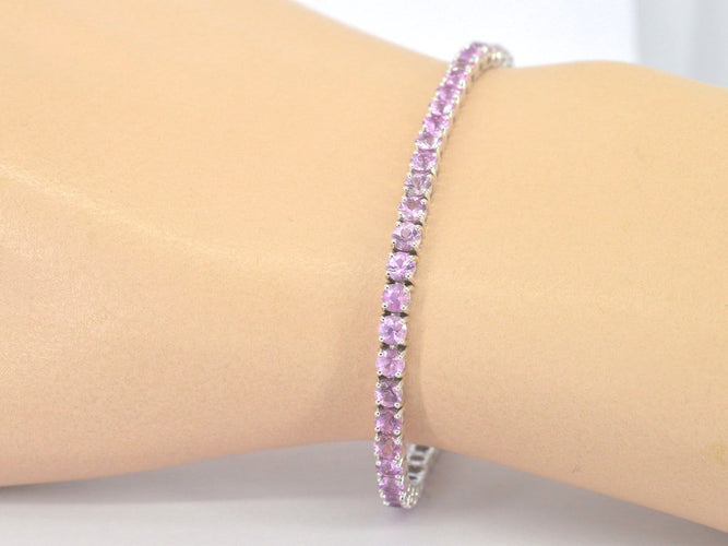 Bracelet tennis en or blanc et saphirs roses 58 Facettes 2903