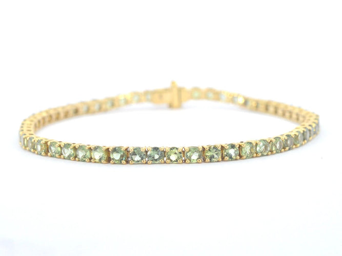 Bracelet tennis en or 14 carats et saphirs verts 58 Facettes 2905