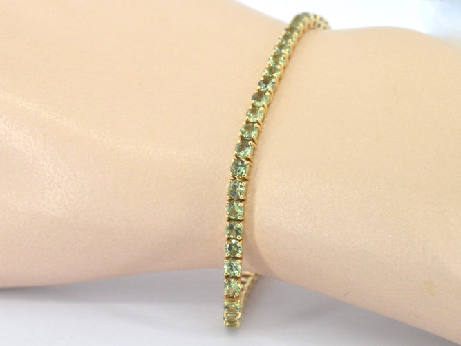 Bracelet tennis en or 14 carats et saphirs verts 58 Facettes 2905