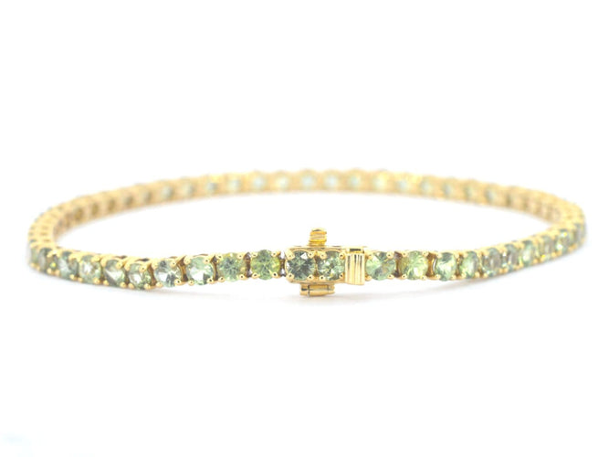Bracelet tennis en or 14 carats et saphirs verts 58 Facettes 2905