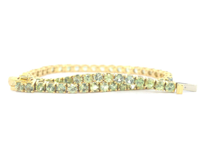 Bracelet tennis en or 14 carats et saphirs verts 58 Facettes 2905