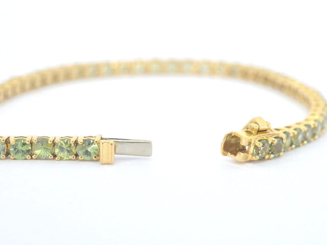 Bracelet tennis en or 14 carats et saphirs verts 58 Facettes 2905