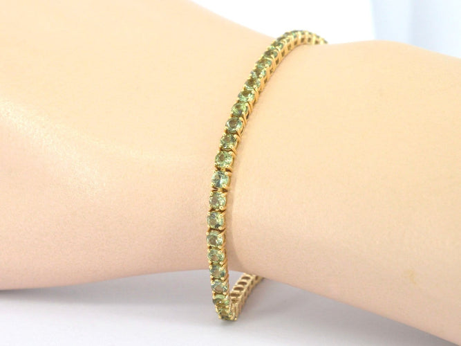 Bracelet tennis en or 14 carats et saphirs verts 58 Facettes 2905