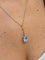 Pendentif et chaîne en deux ors 18 carats et aigue-marine 58 Facettes 91014