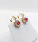 Boucles d'oreilles Dormeuses marguerite en or 18k, rubis synthétiques et diamants 58 Facettes A07748