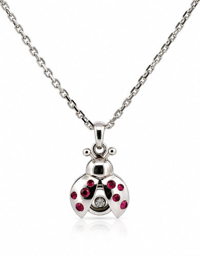 Chopard Lady Bird - Pendentif et chaîne en or blanc, rubis et diamant 58 Facettes Coci