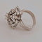 Bague 52 Bague fleur en or blanc et diamants 58 Facettes 2690414