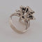 Bague 52 Bague fleur en or blanc et diamants 58 Facettes 2690414