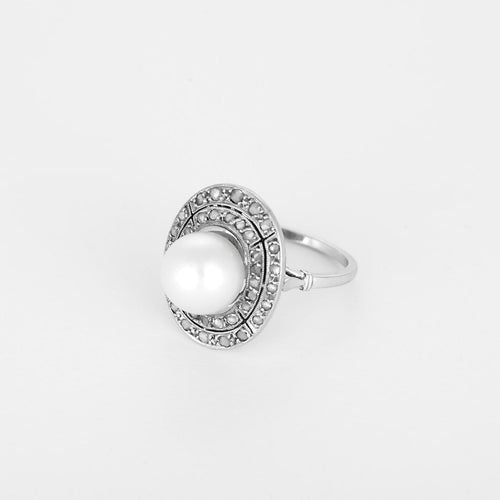 Bague 56 Bague en platine, or blanc, perle et diamants 58 Facettes B260534