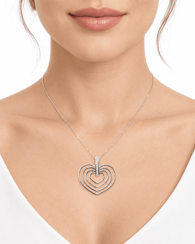 Collier Collier 4 cœurs en or blanc et diamants 58 Facettes 26383