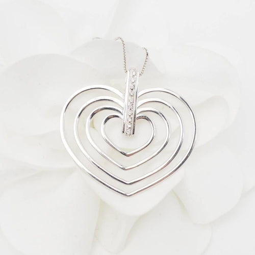 Collier Collier 4 cœurs en or blanc et diamants 58 Facettes 26383