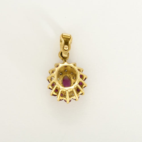 Pendentif Pendentif marguerite en or jaune, rubis et diamants 58 Facettes B260540