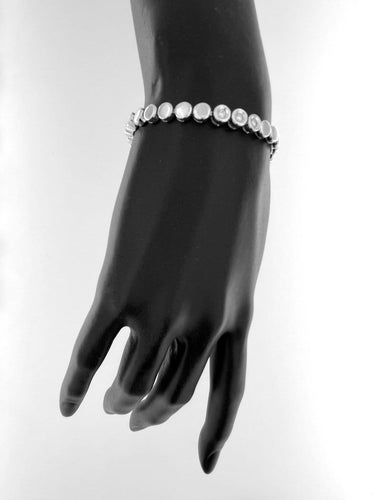 Bracelet Bracelet tennis suisse en or blanc 18 carats et diamants 58 Facettes BR1523