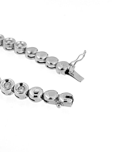 Bracelet Bracelet tennis suisse en or blanc 18 carats et diamants 58 Facettes BR1523