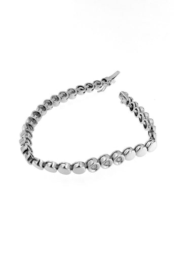 Bracelet Bracelet tennis suisse en or blanc 18 carats et diamants 58 Facettes BR1523