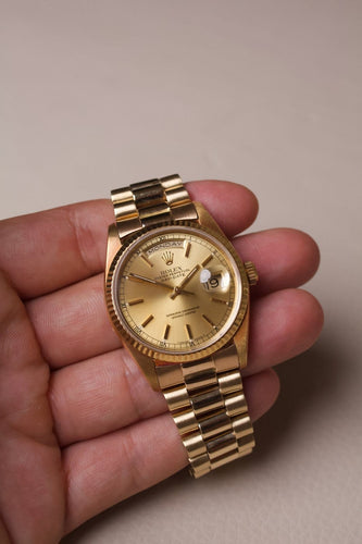 Montre Rolex Day-Date - Montre en or jaune 18 ct cadran champagne 58 Facettes MONTRE-025