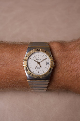 Montre Omega Constellation - Montre GMT en acier et or jaune 18K 58 Facettes MONTRE-026