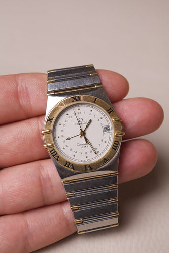Montre Omega Constellation - Montre GMT en acier et or jaune 18K 58 Facettes MONTRE-026
