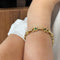 Bracelet Bracelet en or jaune, diamants, saphirs et émeraudes 58 Facettes 250181R