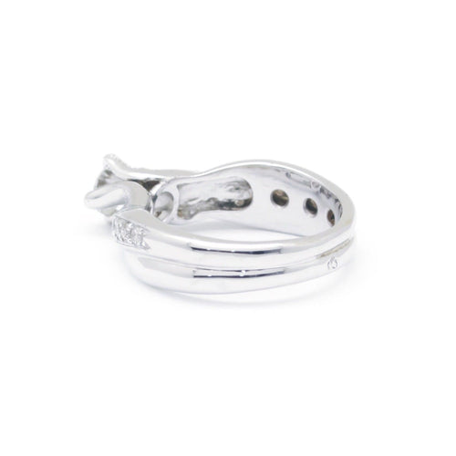 Bague 53 Bague torsadée en or blanc et diamants 0,35 ct 58 Facettes 220562R