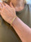 https://cdn.shopify.com/s/files/1/0647/1470/3075/files/BraceletdeLuxe-BraceletJoncOrJaune-JoaillerieParis-LesPierresdeJulie_1.jpg?v=1789815552