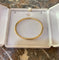 https://cdn.shopify.com/s/files/1/0647/1470/3075/files/BraceletdeLuxe-BraceletJoncOrJaune-JoaillerieParis-LesPierresdeJulie_2.jpg?v=1789815551