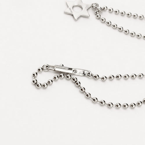 https://18carats.fr/wp-content/uploads/2026/09/37630-38439-Dinh-Van-–-Collier-en-or-blanc-a-pendentif-etoile.jpg