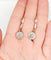 Boucles d'oreilles Dormeuses marguerite anciennes en or 18k, platine et diamants taille rose 58 Facettes A07848