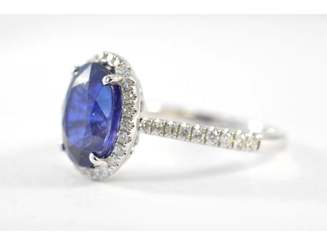 Bague 53 Bague halo en or blanc, diamants et saphir 58 Facettes 1026