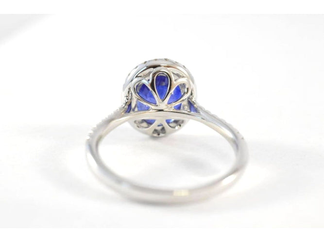 Bague 53 Bague halo en or blanc, diamants et saphir 58 Facettes 1026