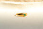 https://cdn.shopify.com/s/files/1/0963/7950/2920/files/bague-jonc-anglais-en-or-jaune-ornee-d-une-emeraude-bague-femme.jpg?v=1790082950