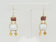 Boucles d'oreilles Boucles d'oreilles pendantes en or jaune 18K, aigues-marines et grenats 58 Facettes 32333