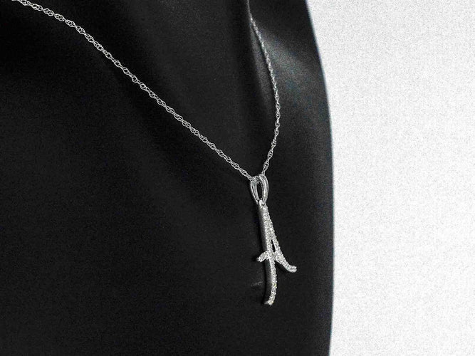 Pendentif Pendentif lettre A en or 14 carats et diamants 58 Facettes 2404