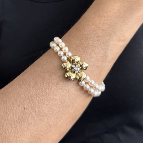 Bracelet Bracelet double rang de perles et diamants en or jaune 18 ct 58 Facettes 27351
