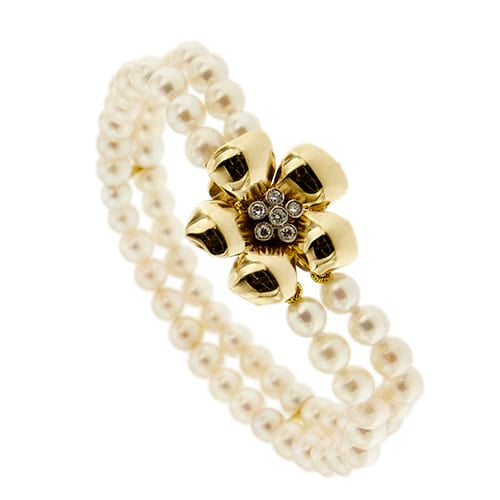 Bracelet Bracelet double rang de perles et diamants en or jaune 18 ct 58 Facettes 27351
