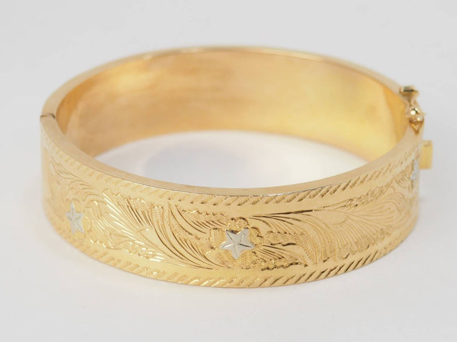 Bracelet Bracelet esclave ouvrant des années 1950 en or jaune et blanc 18 carats 58 Facettes 32206
