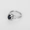 Bague 56 Bague marguerite en platine et or blanc, saphir et diamants 58 Facettes B260416