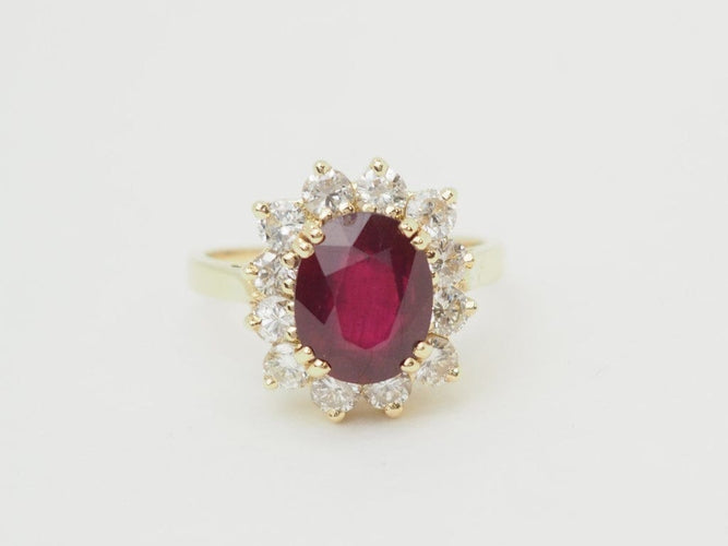 Bague 54 Bague entourage en or jaune 18 carats, rubis 4,03 ct et diamants 1,18 ct 58 Facettes F5046