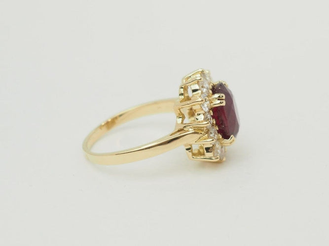 Bague 54 Bague entourage en or jaune 18 carats, rubis 4,03 ct et diamants 1,18 ct 58 Facettes F5046