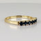 Bague 51 Bague demi-alliance en or jaune 14k avec sept saphirs 58 Facettes 2609003
