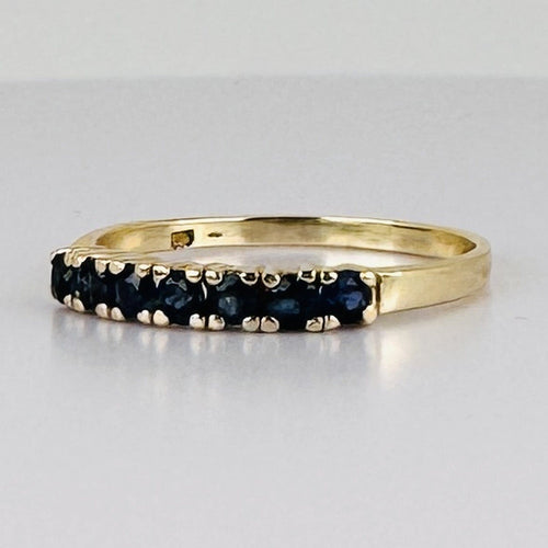 Bague 51 Bague demi-alliance en or jaune 14k avec sept saphirs 58 Facettes 2609003