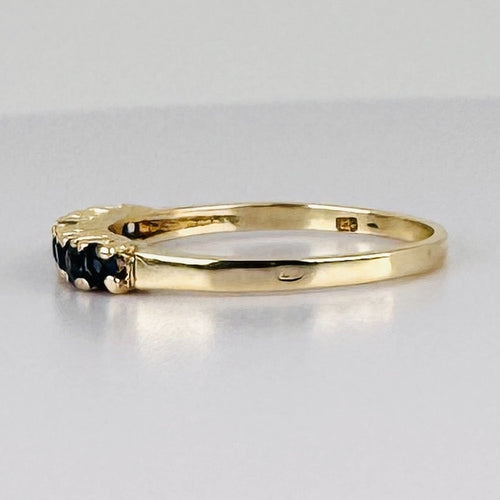 Bague 51 Bague demi-alliance en or jaune 14k avec sept saphirs 58 Facettes 2609003