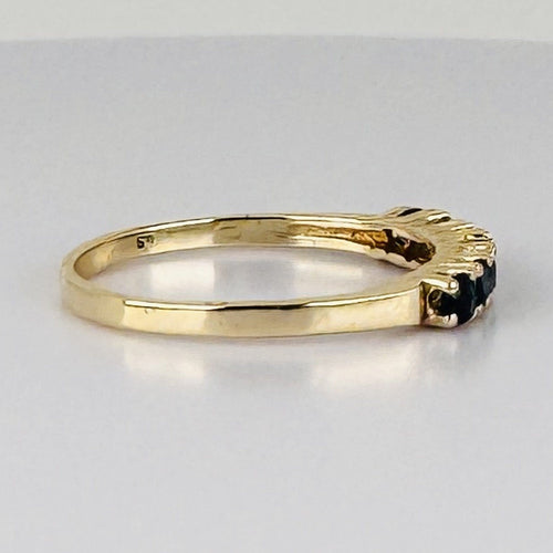 Bague 51 Bague demi-alliance en or jaune 14k avec sept saphirs 58 Facettes 2609003