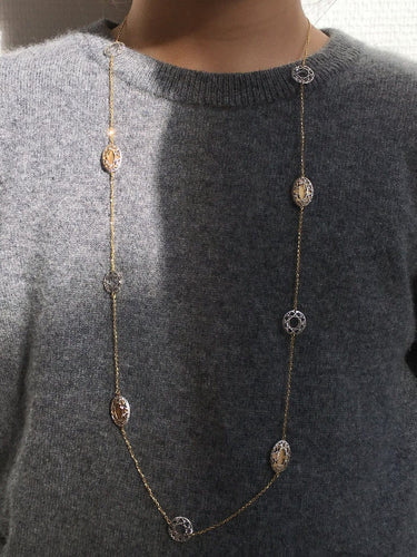 Collier Collier sautoir en or blanc et jaune 18k 58 Facettes 303