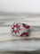 Bague 53 Bague dôme florale en or blanc 18k, rubis et diamants 58 Facettes 305