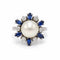 Bague 48 Carl Bucherer - Bague marguerite en or blanc 750‰, perle, diamants et saphirs 58 Facettes 260263R