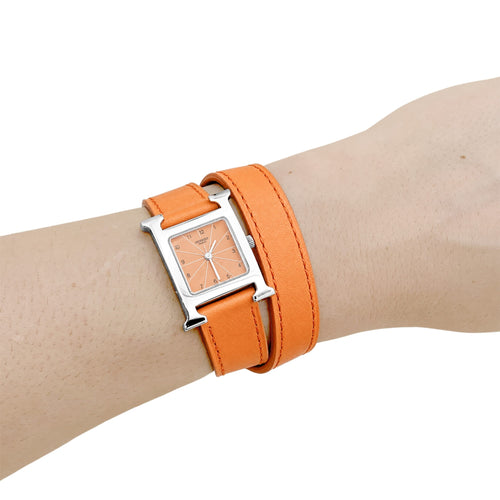 Montre Hermès - Montre Heure H pour femme en acier, cadran orange 58 Facettes 35997