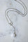 Collier Chanel - Collier Camélia en or blanc, diamants et agate blanche 58 Facettes